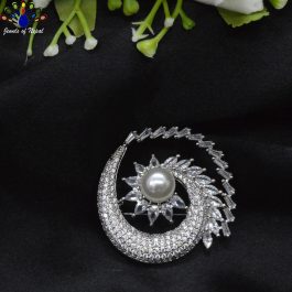 Jewels of Nepal American Diamond Studded & Faux Moti Chakra Designed Brooch for Women