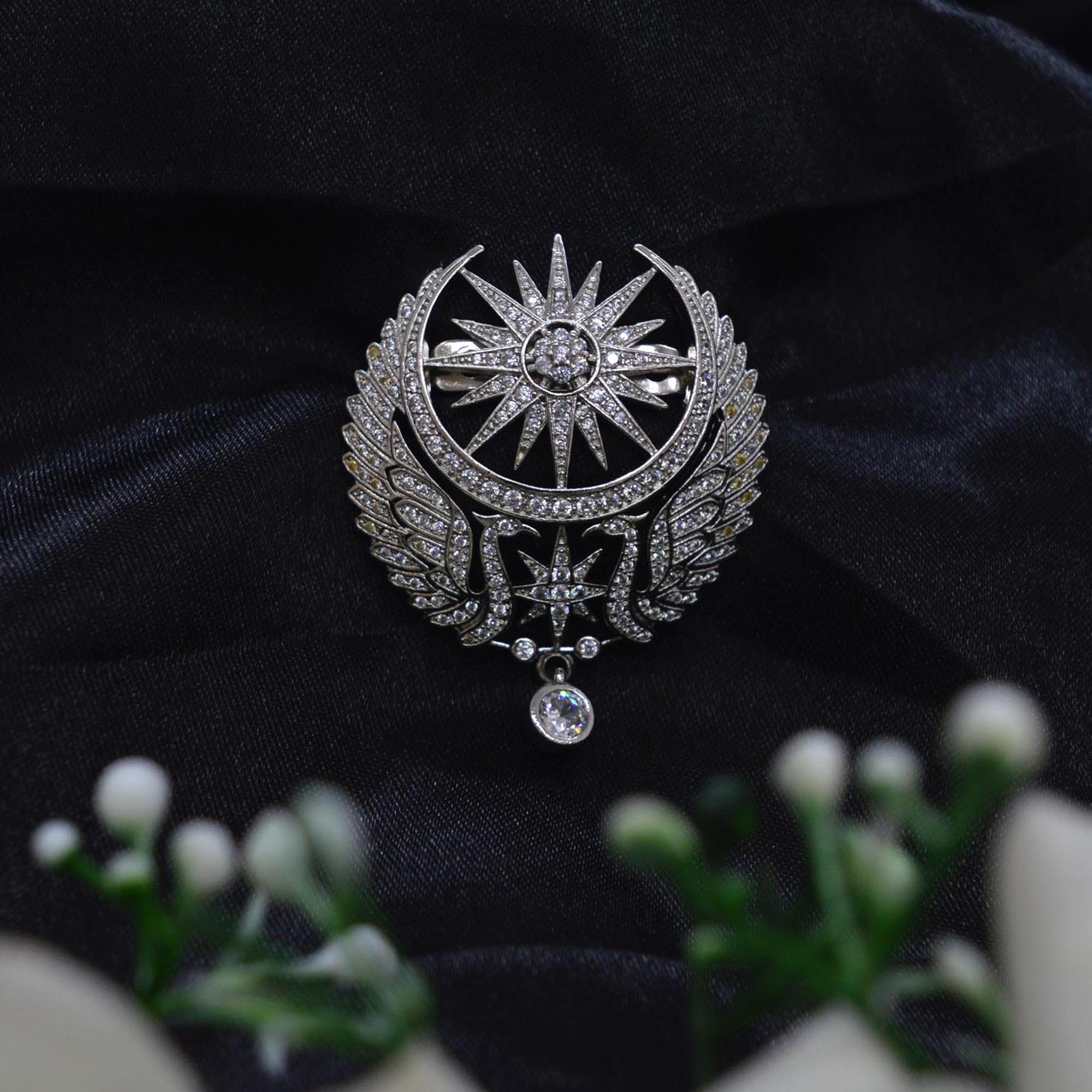Jewels of Nepal American Diamond Studded Sun Star and Peacock Designed Brooch for Women